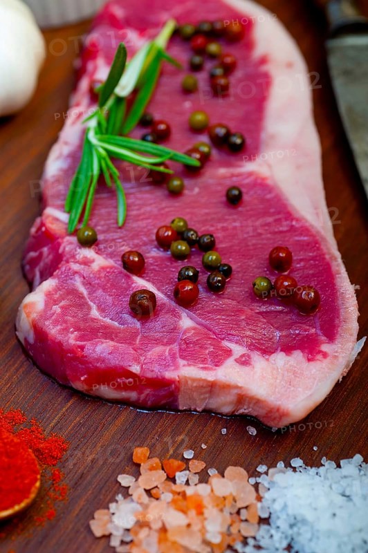 Raw uncooked ribeye beef steak butcher selection