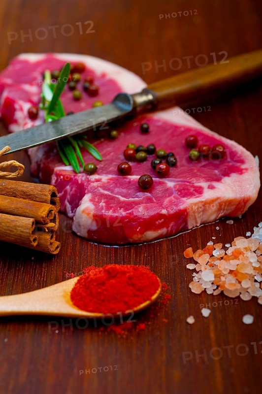 Raw uncooked ribeye beef steak butcher selection