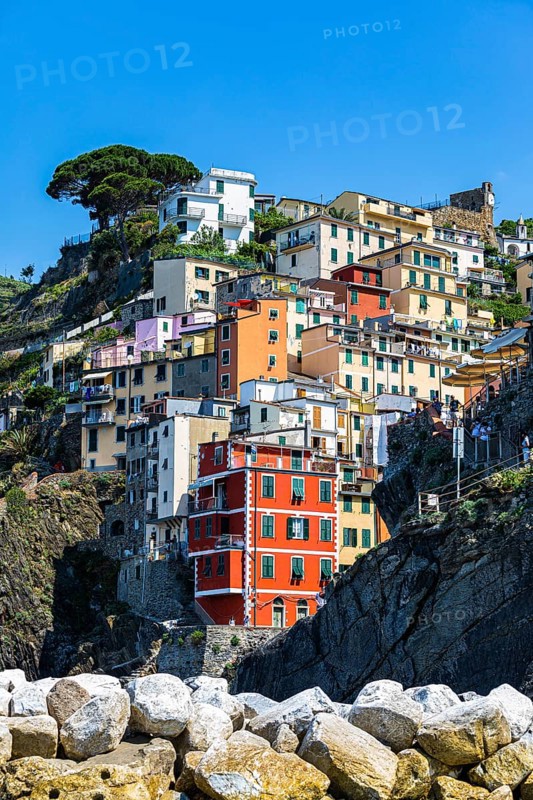 The village of Riomaggiore with its nested pastel-coloured houses built into the hillside