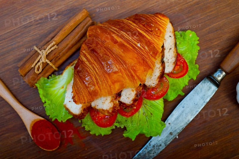 Savory croissant brioche bread with chicken breast and vegetable rustic style
