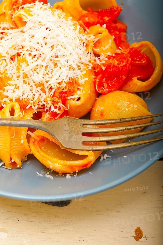 Italian snail lumaconi pasta with ripe cherry tomatoes sauce ingredients