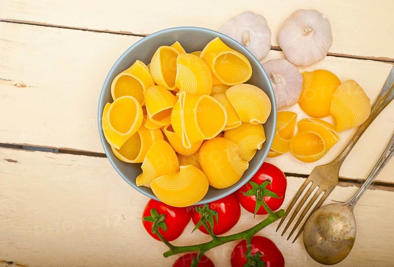 Italian snail lumaconi pasta with ripe cherry tomatoes sauce ingredients