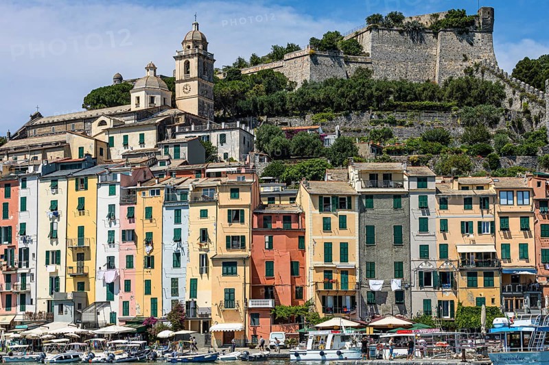 Pastel-coloured house facades in the harbour of Portovenere