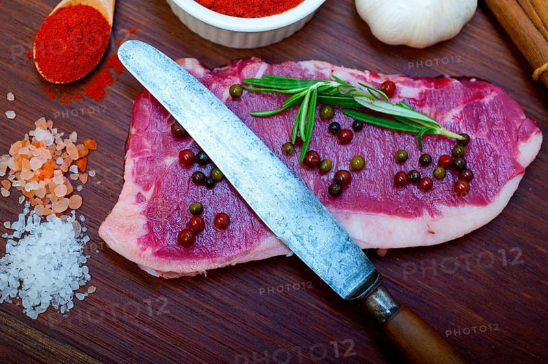 Raw uncooked ribeye beef steak butcher selection