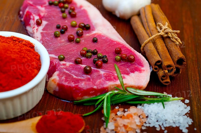 Raw uncooked ribeye beef steak butcher selection