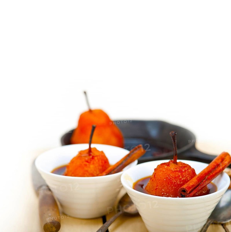 Poached pears delicious home made recipe ove white rustic wood table