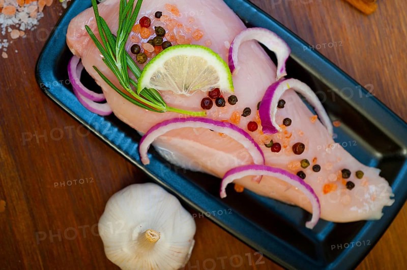 Fresh organic chicken breast with herbs and spices