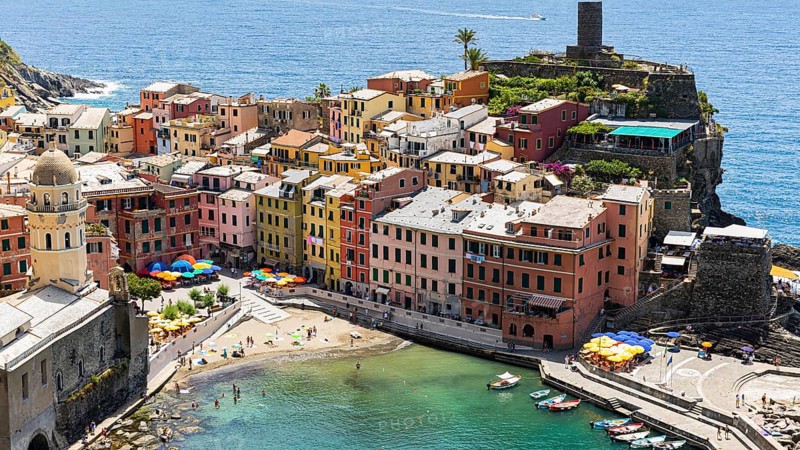 The village of Vernazza with its nested pastel-coloured houses built into the hillside