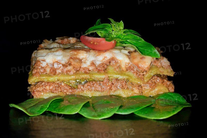 Classic lasagne with spinach leaves