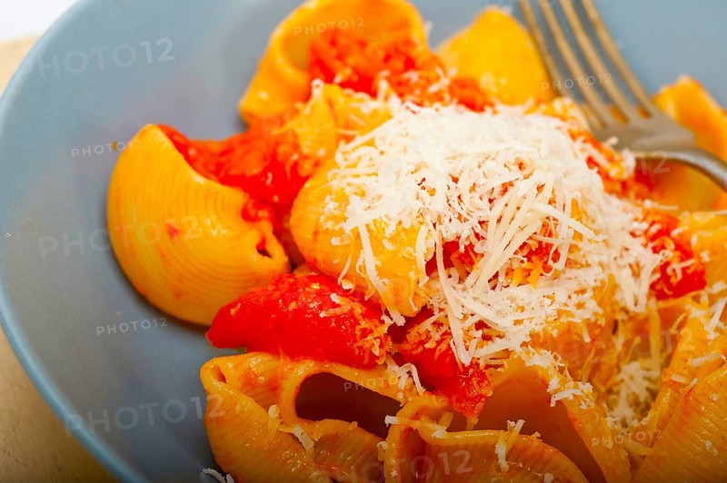 Italian snail lumaconi pasta with ripe cherry tomatoes sauce ingredients