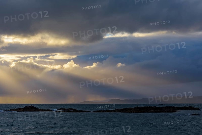 Scottish coast at sunset with sunrays
