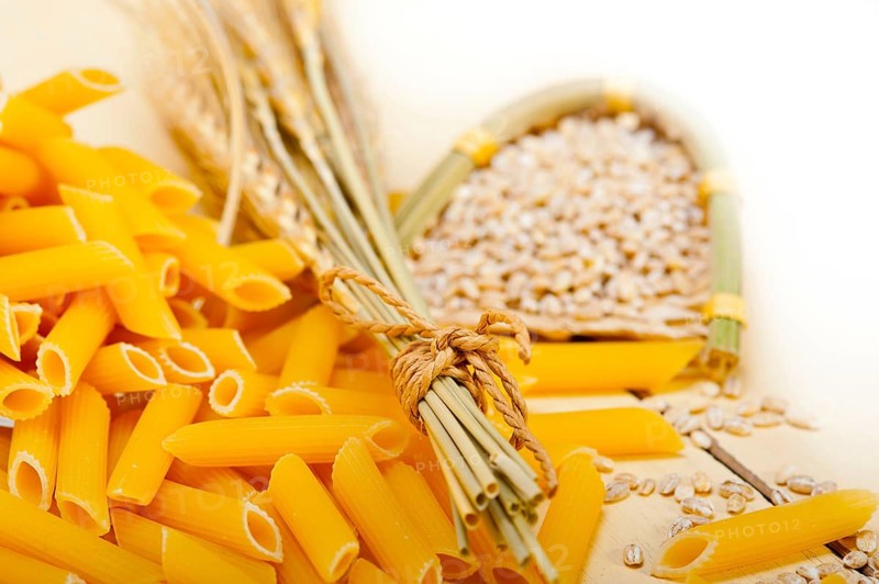 Short Italian pasta penne with durum wheat grains