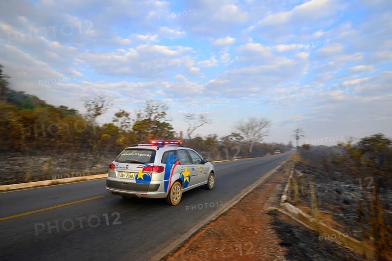Military police vehicle on the main road 251 during a bush fire