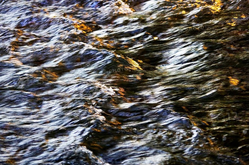 Flowing water with light reflections
