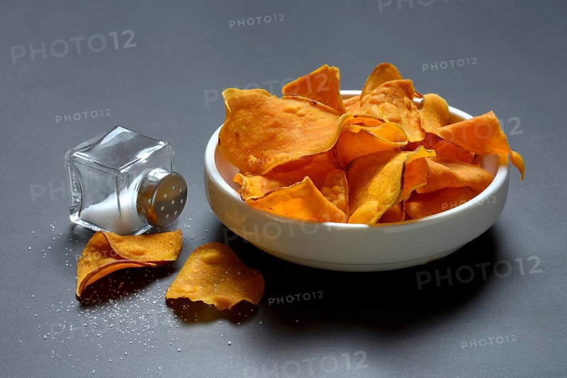 Sweet crisps in skin and salt container