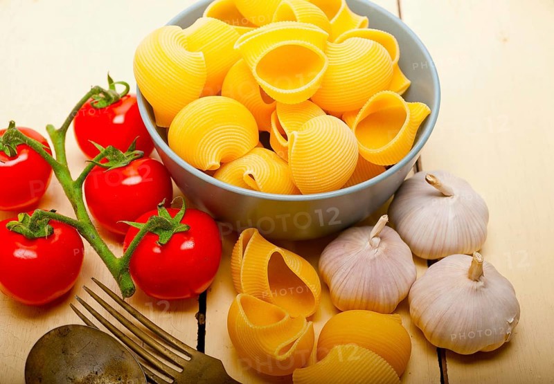 Italian snail lumaconi pasta with ripe cherry tomatoes sauce ingredients