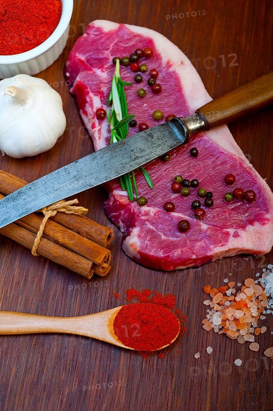 Raw uncooked ribeye beef steak butcher selection