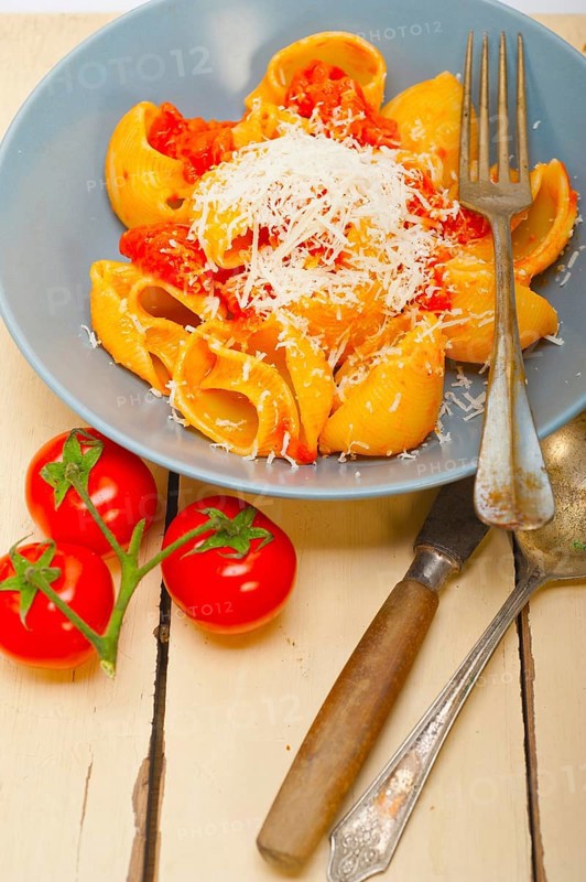 Italian snail lumaconi pasta with ripe cherry tomatoes sauce ingredients