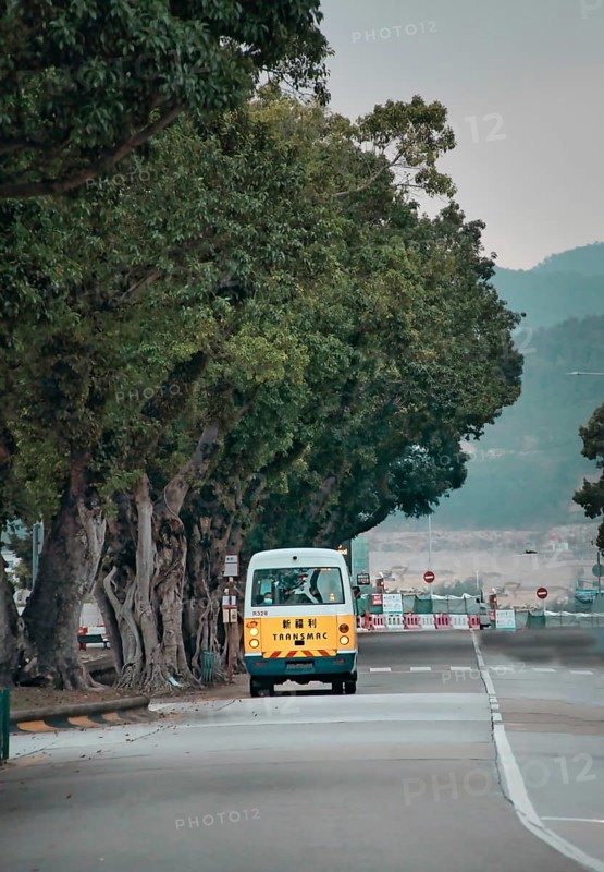 Yellow bus on the street in Macau