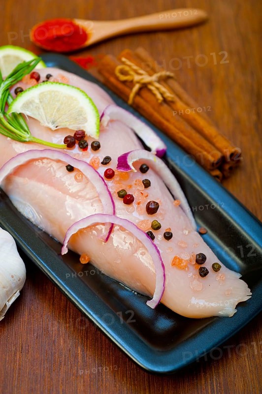 Fresh organic chicken breast with herbs and spices