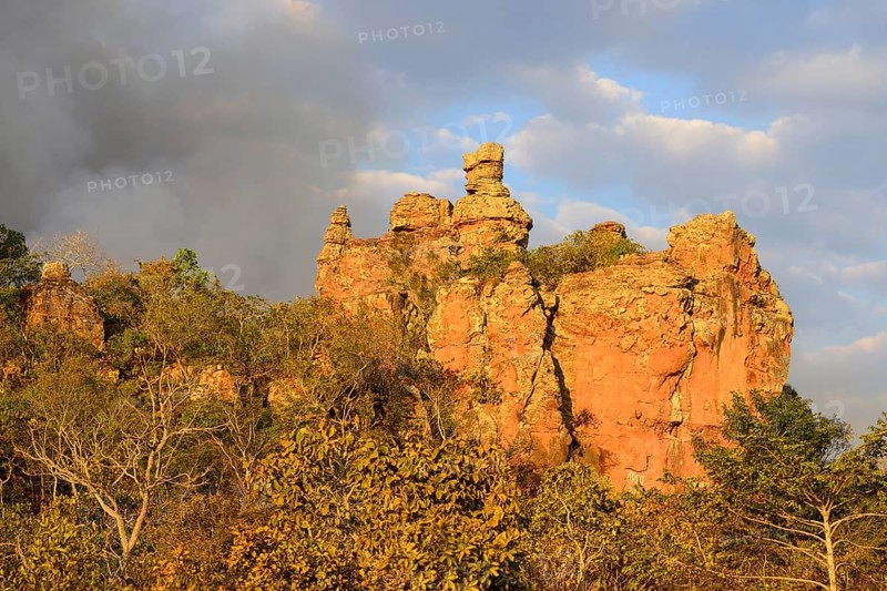 Bizarre rock formation and clouds of smoke during a bushfire