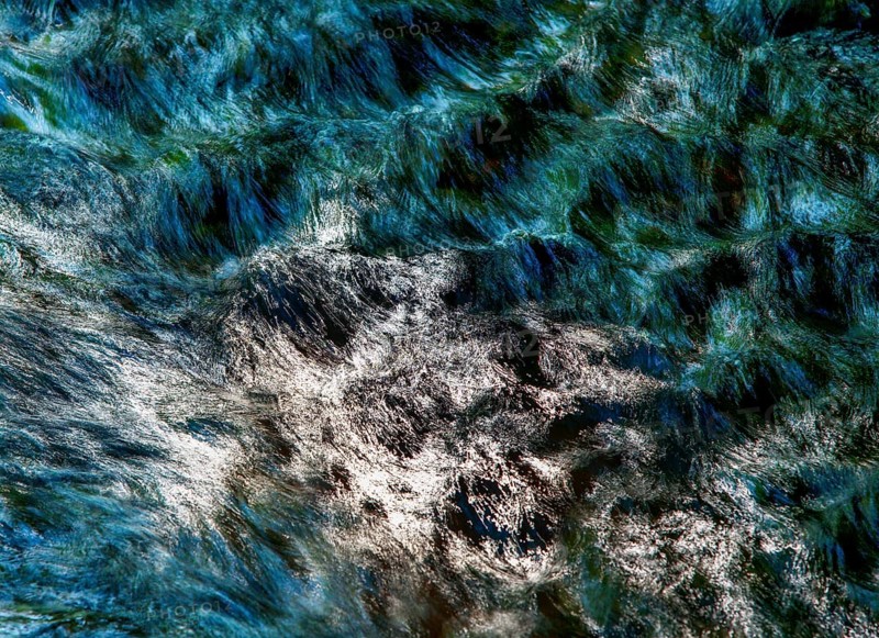 Flowing water with light reflections