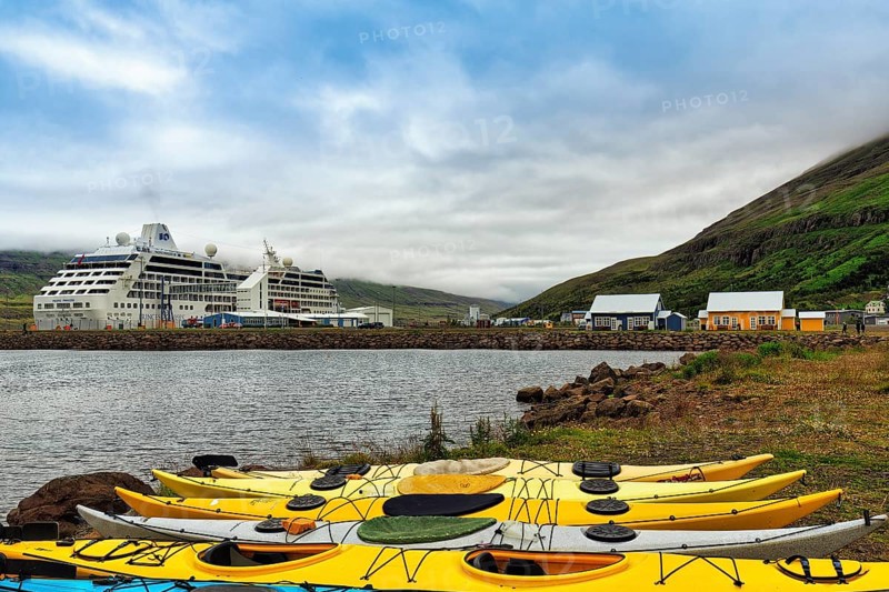 Colourful Kayaks on the Shore of the Fjord