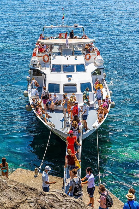 Tourists embark on the liner at Cinque Terre