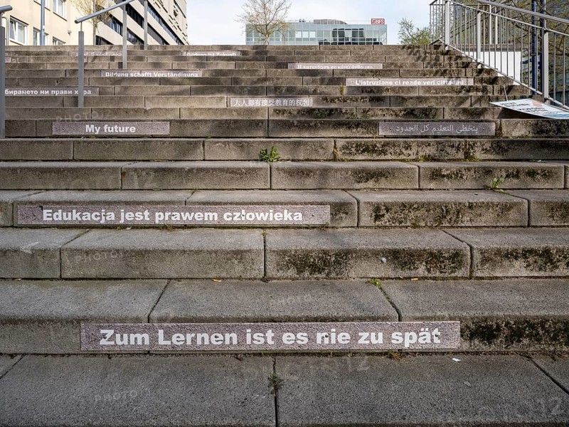 Stairway steps with slogans on the subject of education in several languages