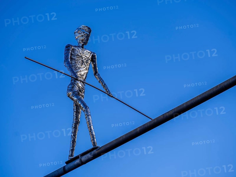 Stainless steel sculpture 'Walking Man' by the Frankfurt artist E. R. Nele above Friedberger Strasse