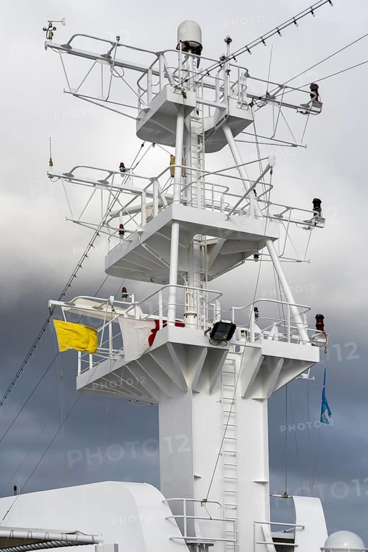 Cruise ship with yellow flag
