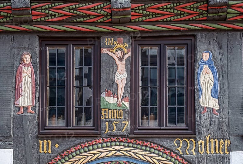 Depiction of the crucified Christ above the portal of the Adam- und Evahaus