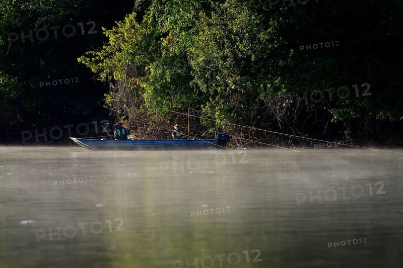 Two anglers in a boat on the Rio Sao Lourenco