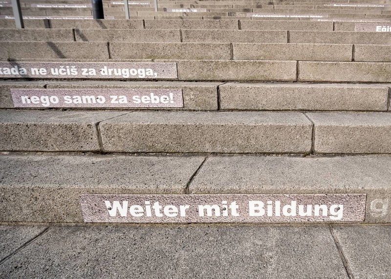 Stairway steps with slogans on the subject of education in several languages