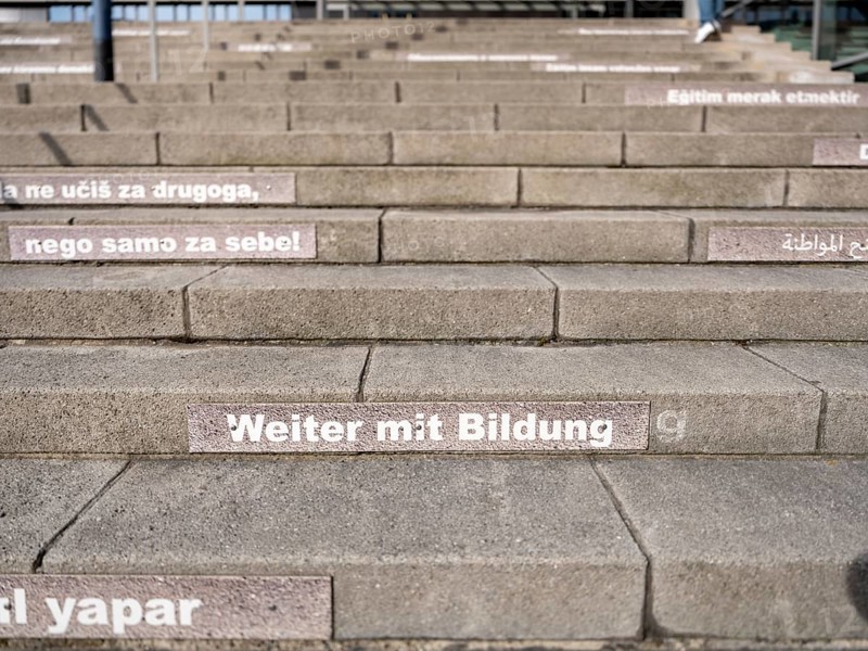 Stairway steps with slogans on the subject of education in several languages