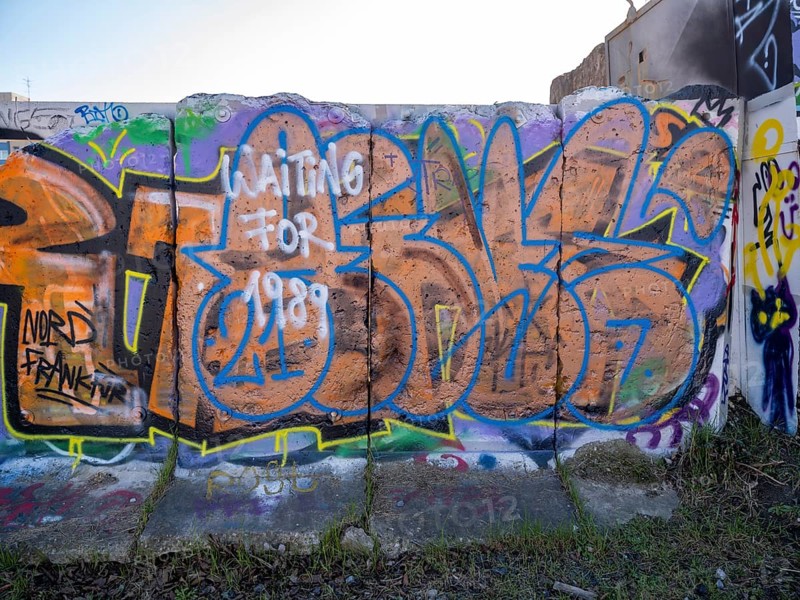 Graffiti on wall remains behind the Urban Gardening project at a new development area at the Old Harbour