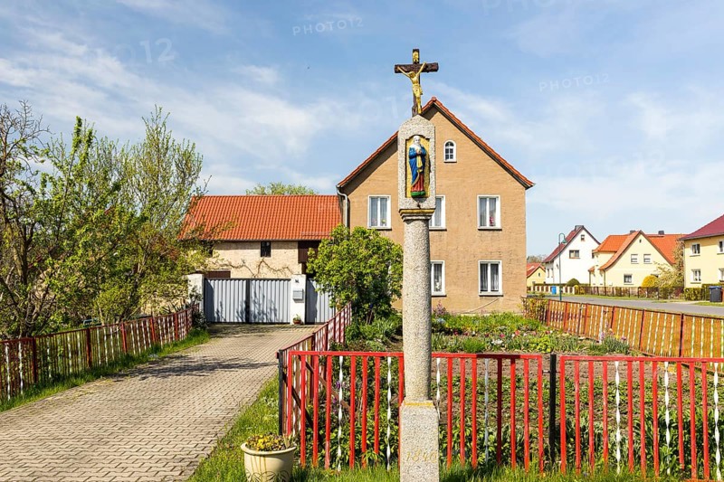 Wayside shrine in front of a residential house