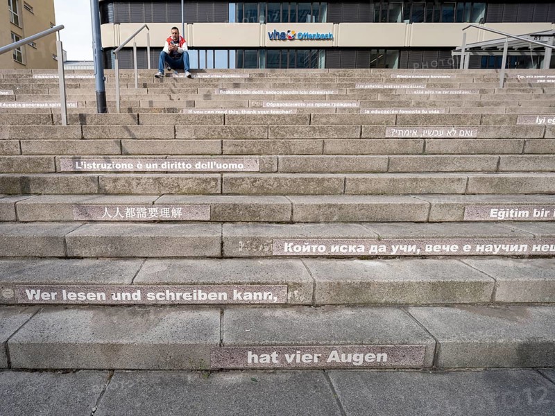 Stairway steps with slogans on the subject of education in several languages