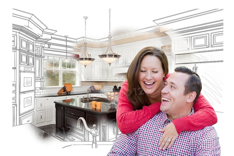 Happy laughing couple with kitchen design drawing and photo behind
