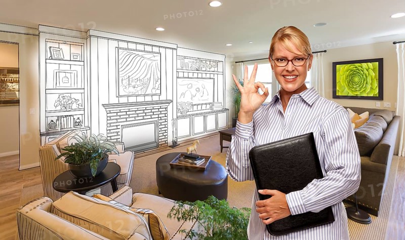 Happy woman with okay sign over custom living room and design drawing