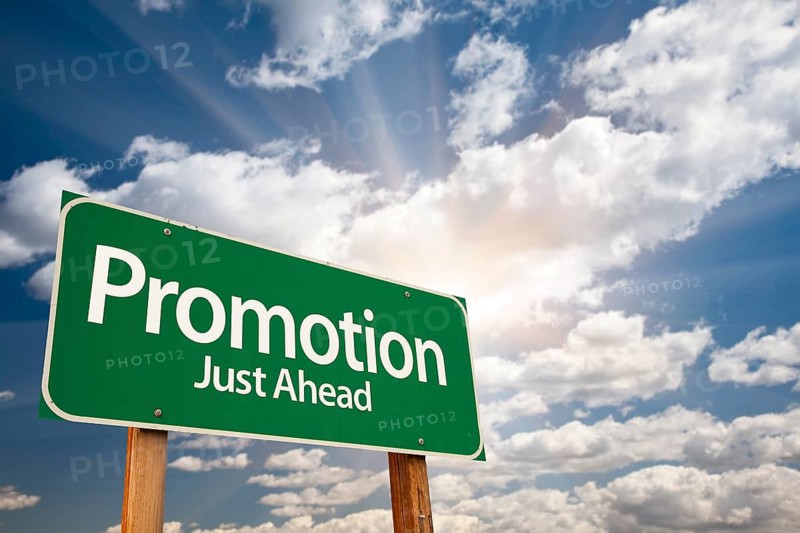 Promotion green road sign with dramatic clouds and sky