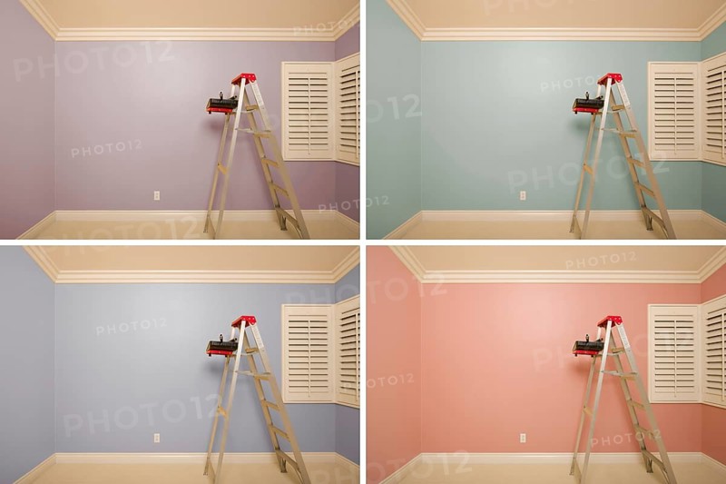 Set of empty rooms painted in variety of colors with ladder