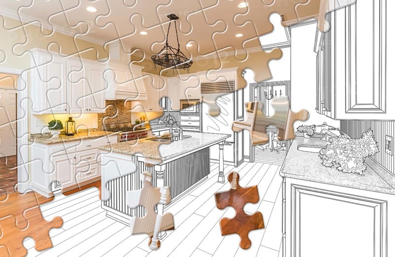 Puzzle pieces fitting together revealing finished kitchen build over drawing