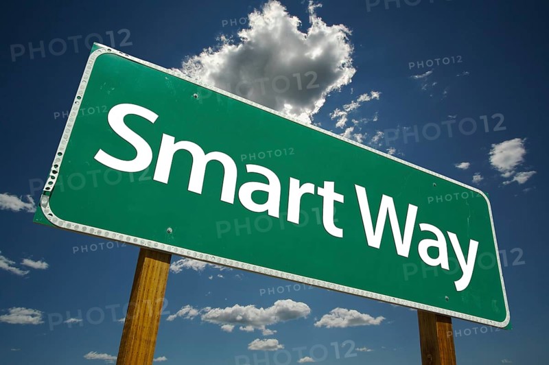 Smart way green road sign with dramatic clouds and sky