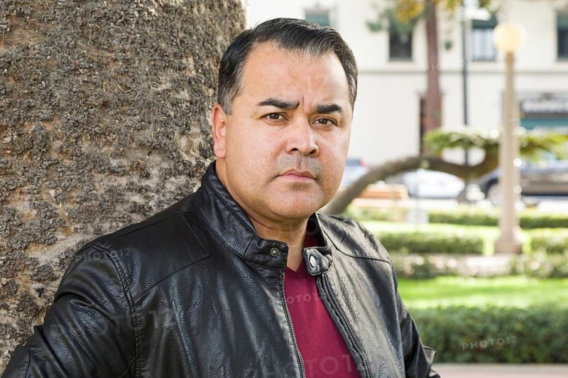 Headshot portrait of handsom hispanic man