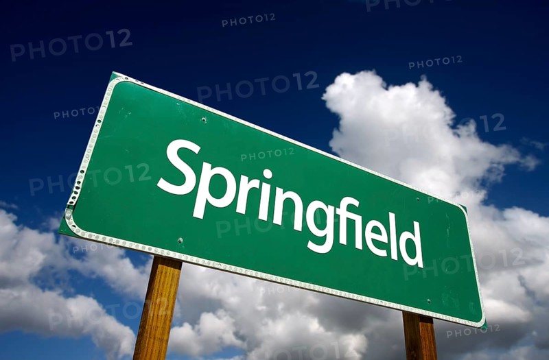 Springfield road sign with dramatic blue sky and clouds
