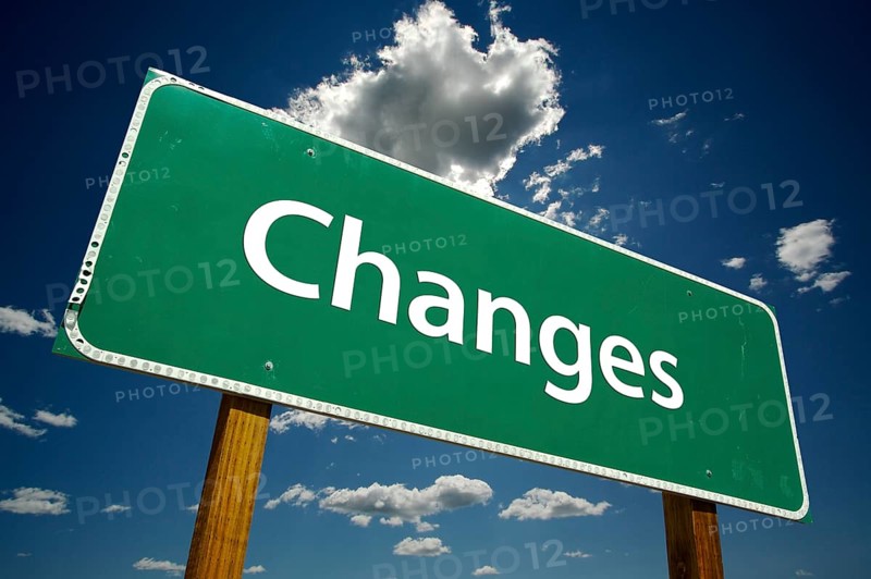 Changes road sign with dramatic blue sky and clouds