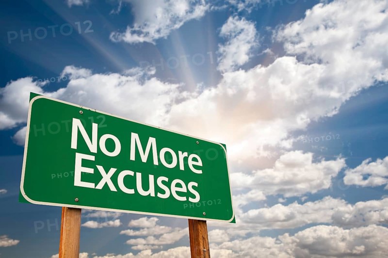 No more excuses green road sign with dramatic clouds and sky