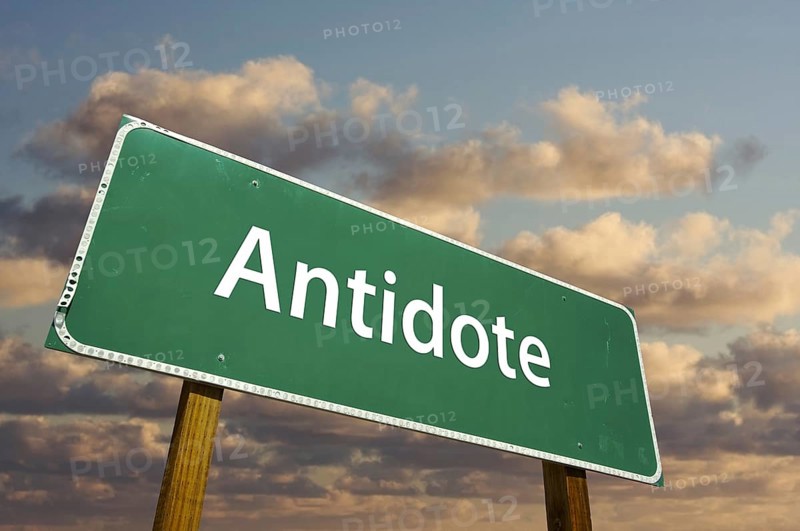 Antidote green road sign with dramatic clouds and sky