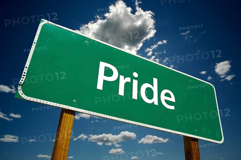 Pride road sign with dramatic clouds and sky